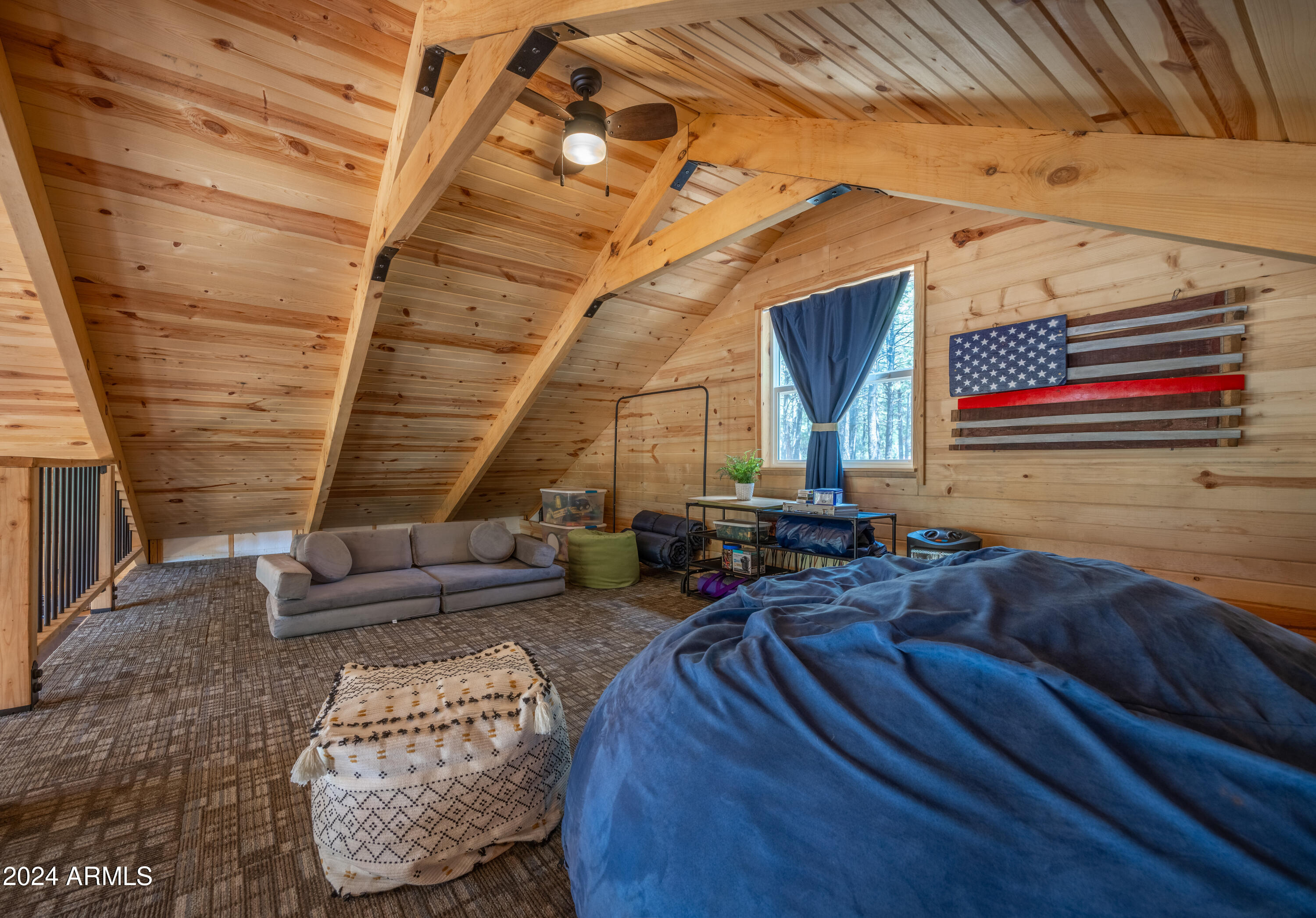 1225 Highway Loop Forest Lakes, AZ 85931 - Photo 27 of 45 a living room with furniture and a rug