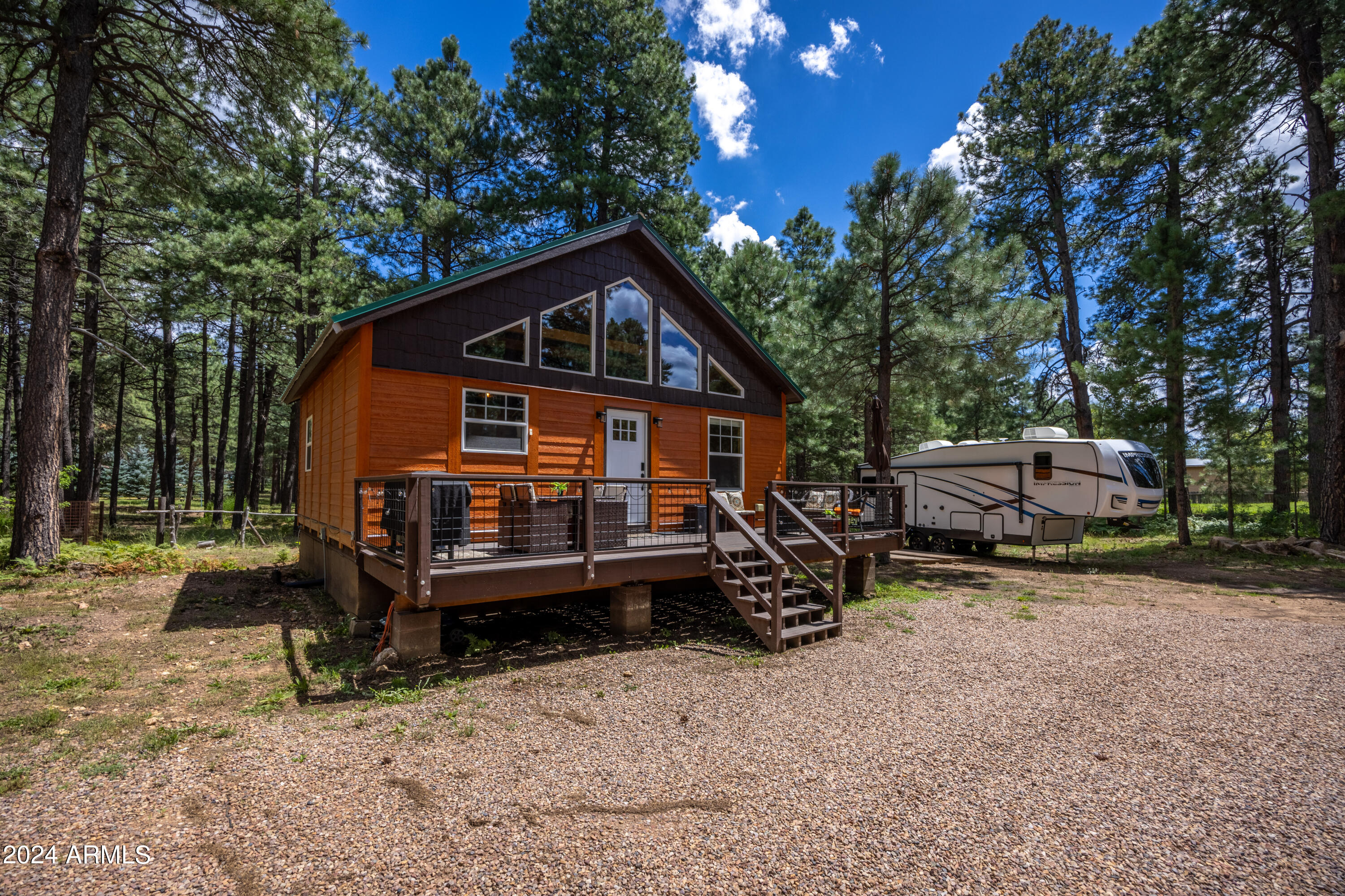 1225 Highway Loop Forest Lakes, AZ 85931 - Photo 29 of 45 a front view of a house with a garden and trees