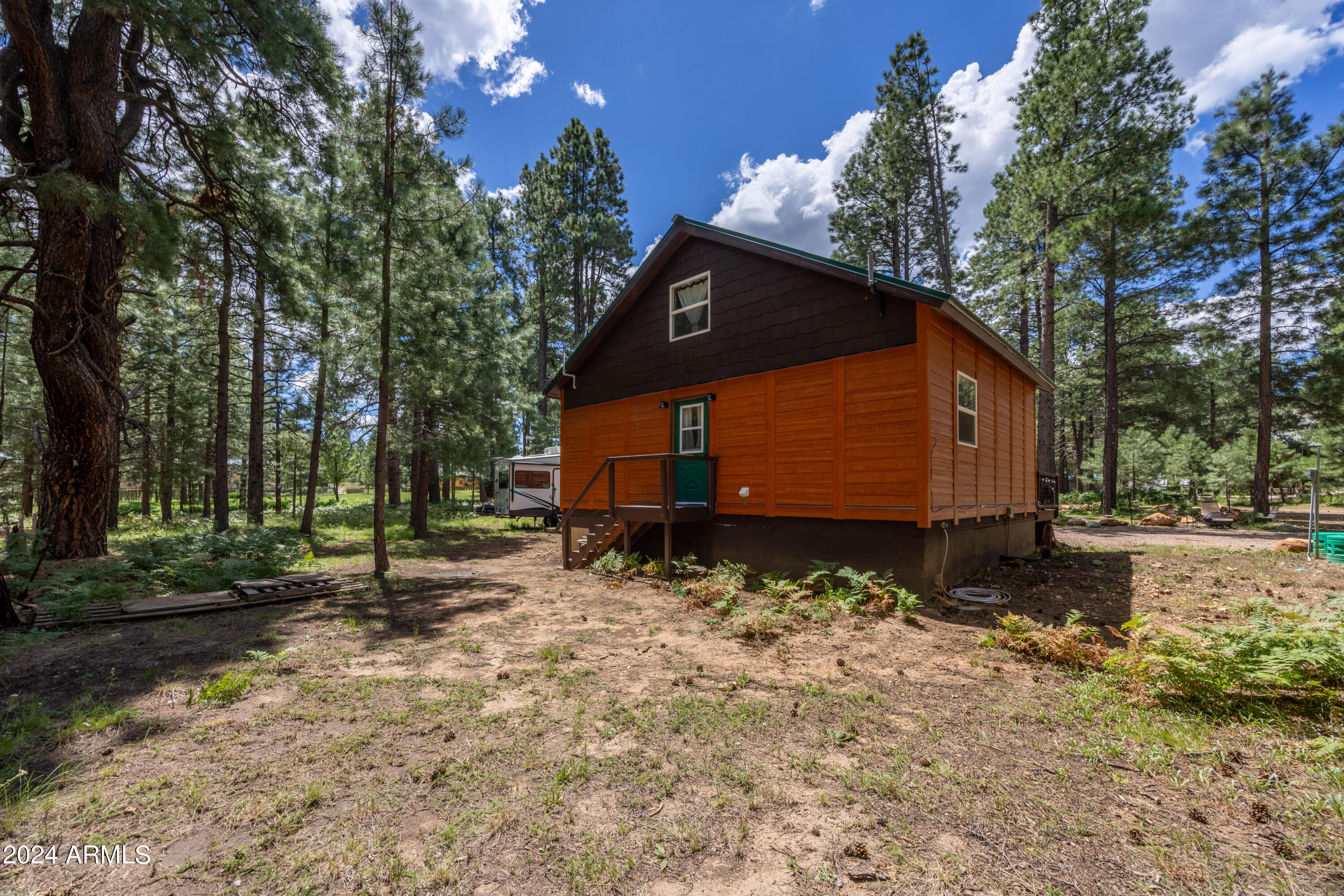 1225 Highway Loop Forest Lakes, AZ 85931 - Photo 33 of 45 a view of a house with a yard