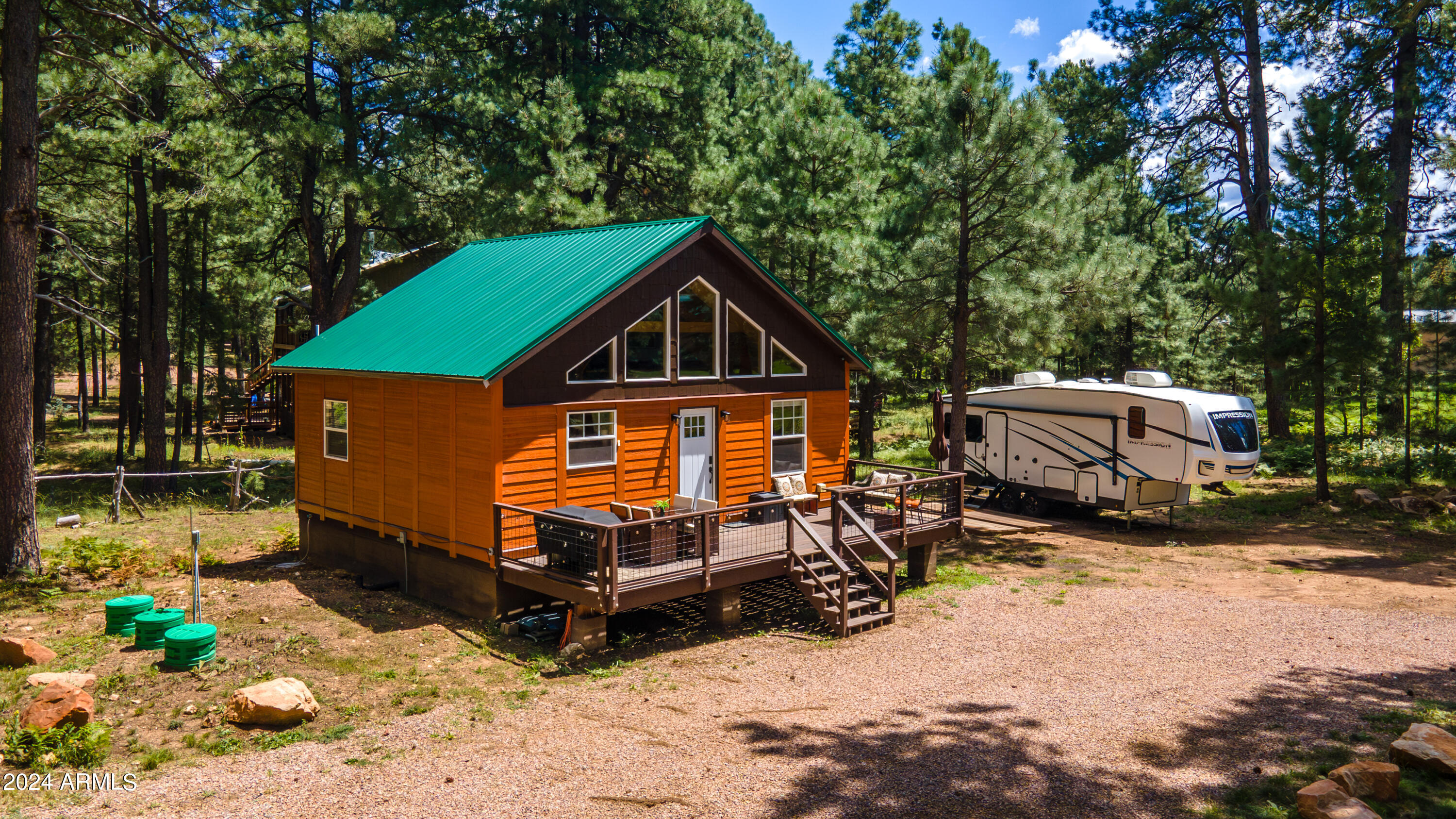 1225 Highway Loop Forest Lakes, AZ 85931 - Photo 35 of 45 a view of a house with a yard chairs and floor to ceiling window