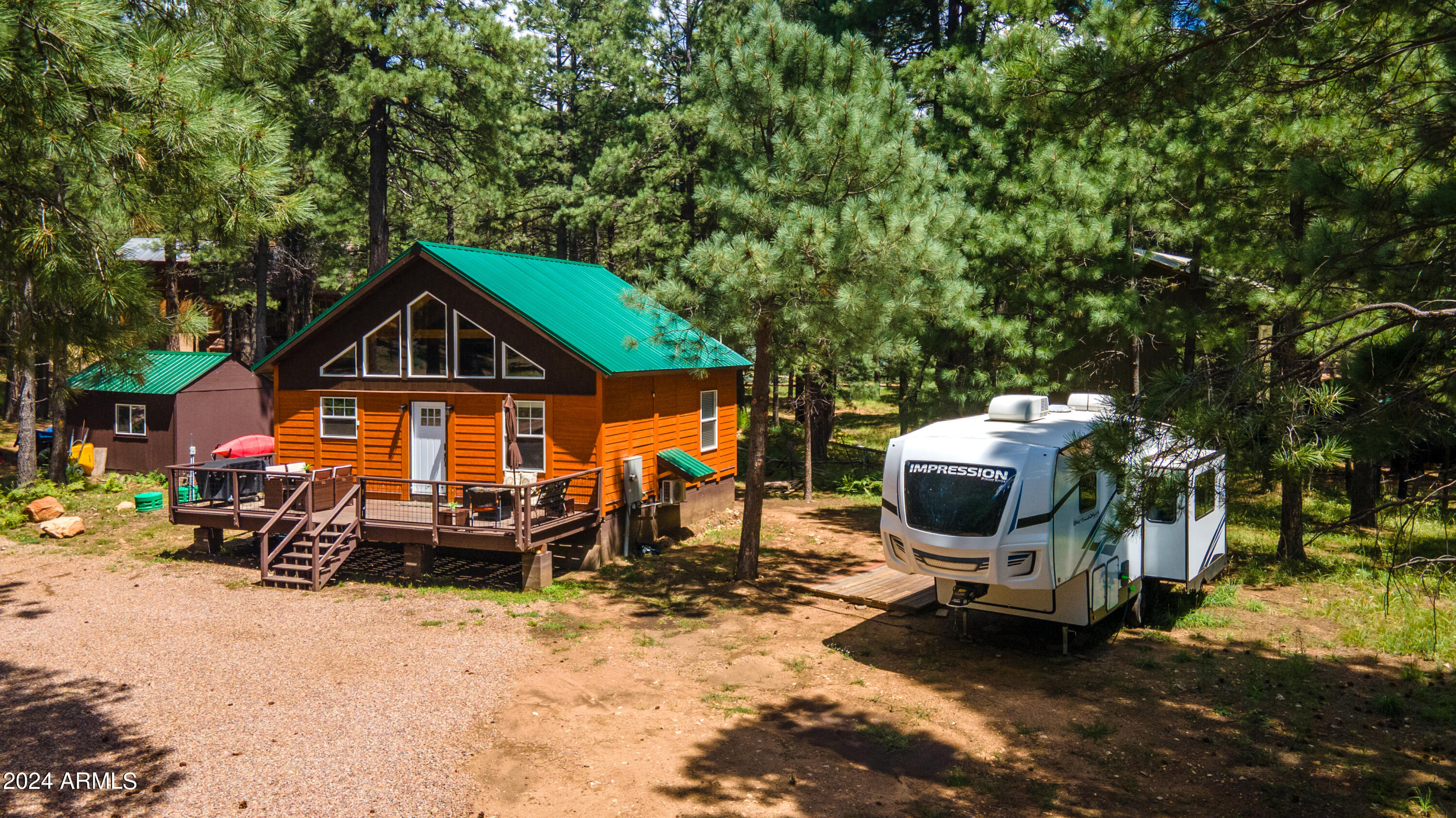 1225 Highway Loop Forest Lakes, AZ 85931 - Photo 6 of 45 a front view of a house with patio