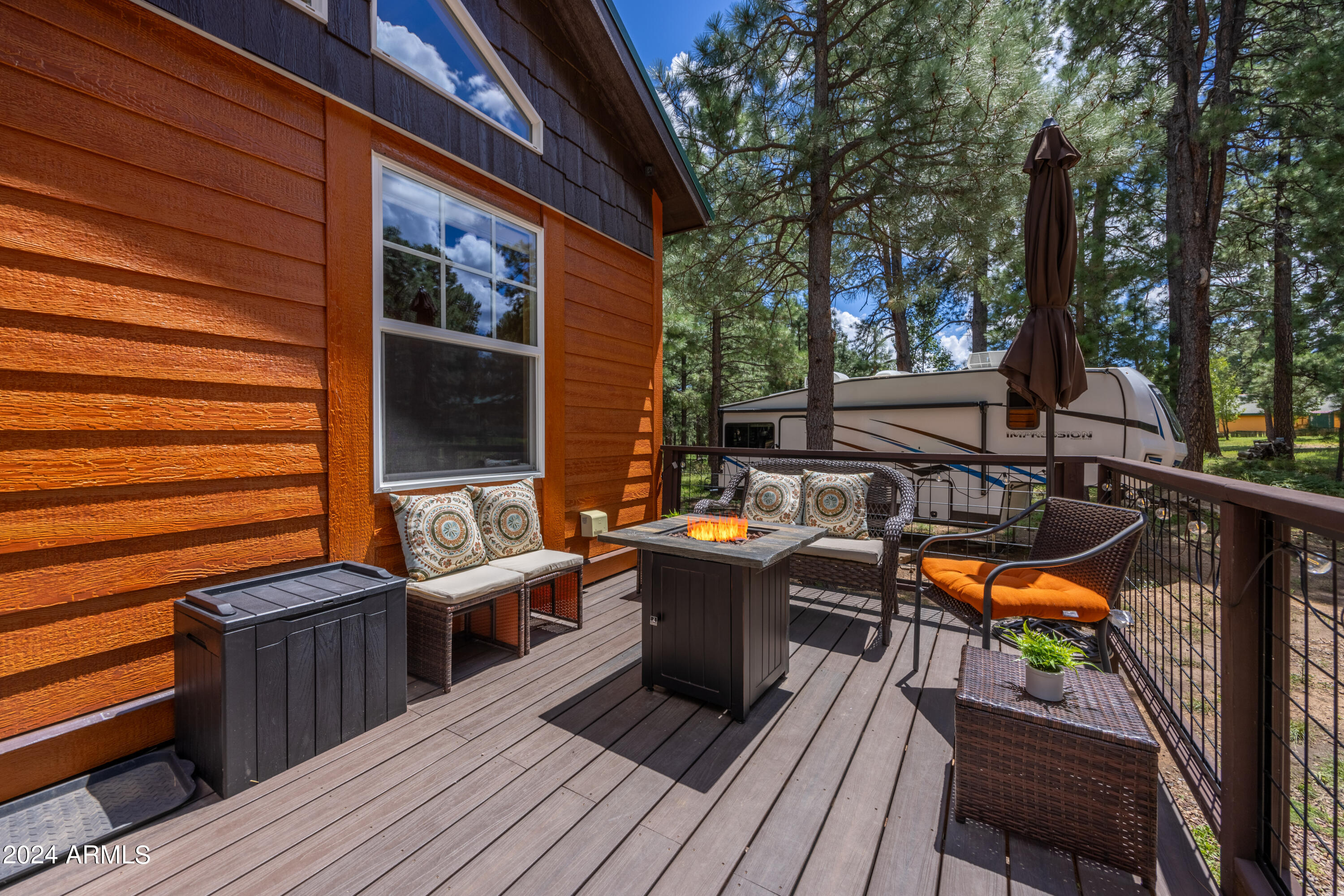 1225 Highway Loop Forest Lakes, AZ 85931 - Photo 9 of 45 a balcony with furniture and wooden floor