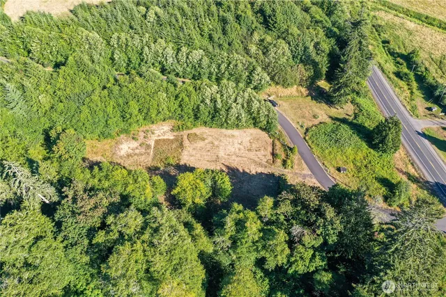 an aerial view of a houses with a lake view