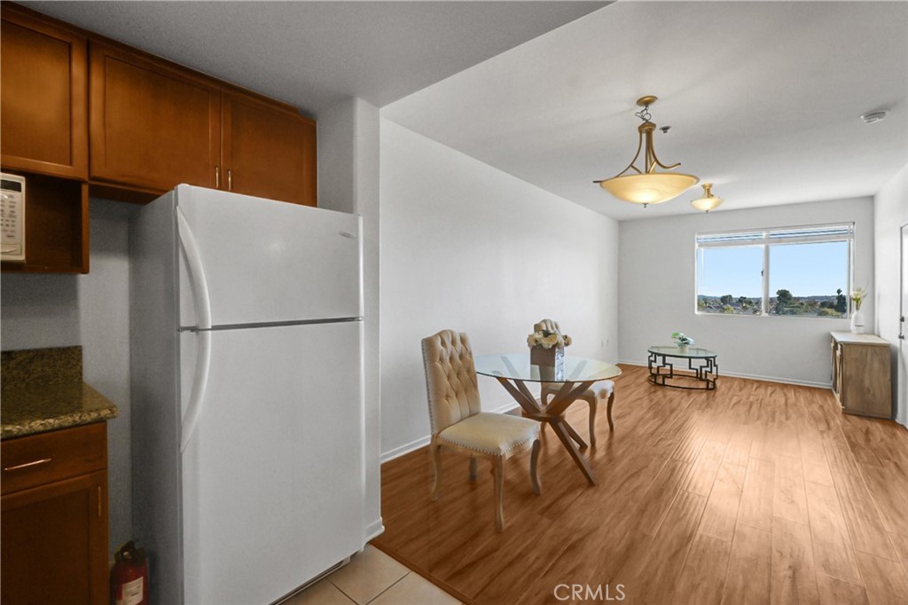 580 West Main Street, Unit 318 Alhambra, CA 91801 - Photo 11 of 33 a dining room with furniture and chandelier