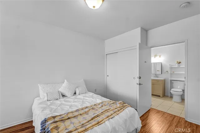 a bedroom with a bed and a view of bathroom