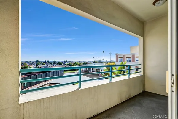 a view of a balcony with city view