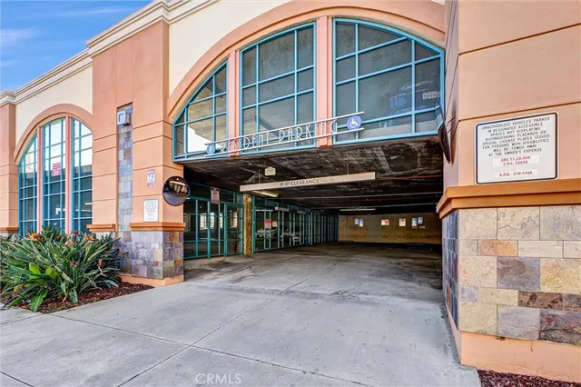 a black and white building with glass windows