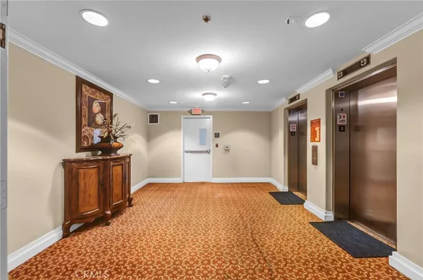 a view of a hallway with a kitchen