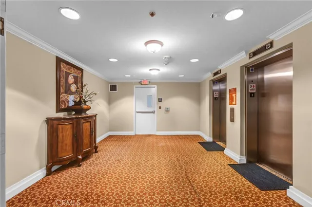 a view of a hallway with a kitchen