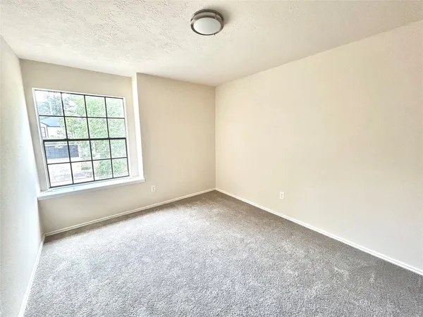 an empty room with a empty space and a window