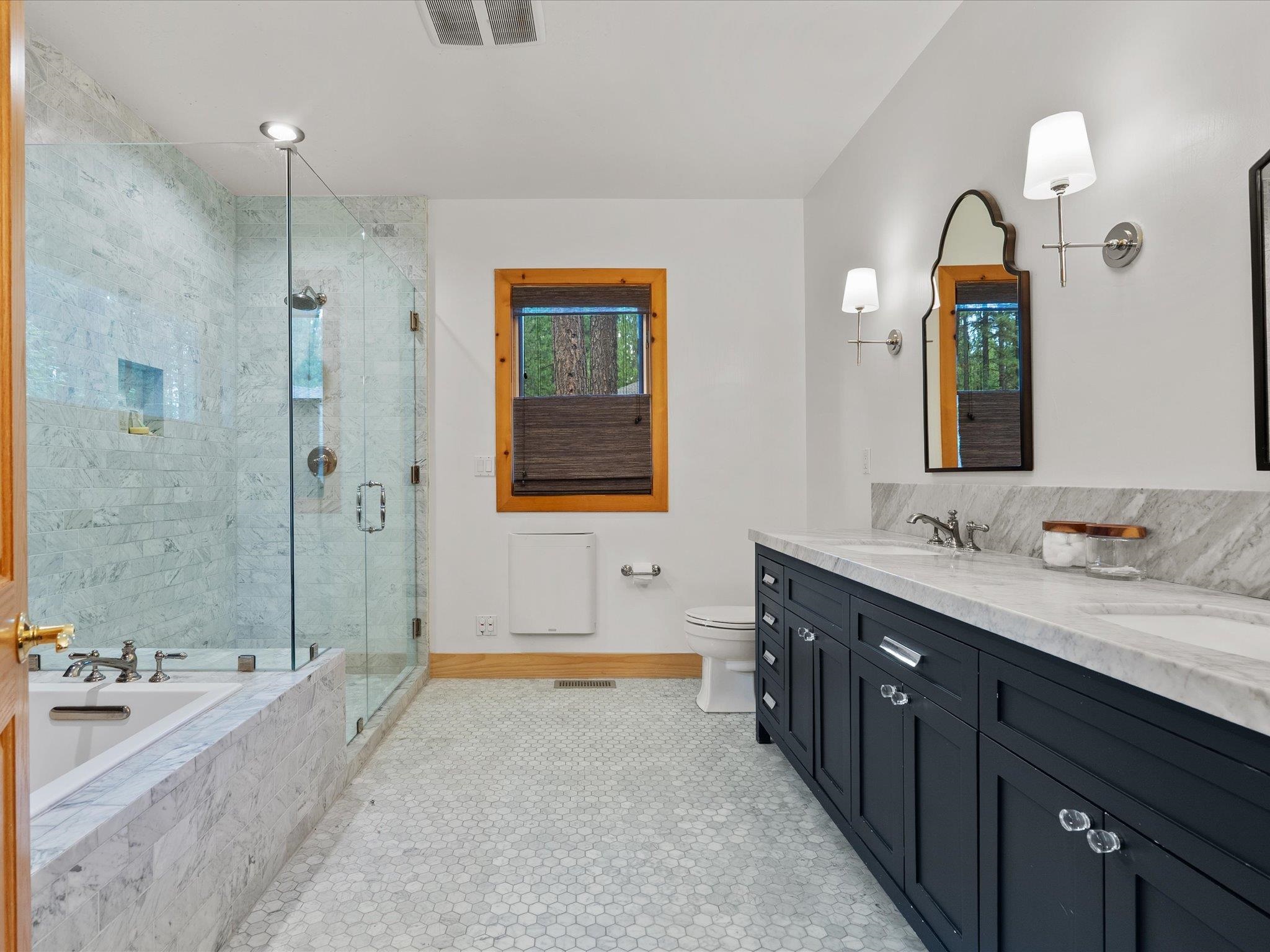 355 Quail View Circle Clio, CA 96106 - Photo 34 of 48 a spacious bathroom with a tub sink and mirror