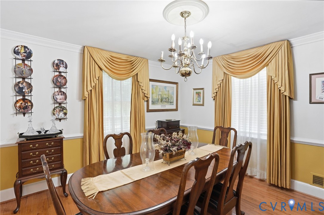 11016 Pridesville Road Amelia Court House, VA 23002 - Photo 23 of 54 a view of a dining room with furniture window and wooden floor