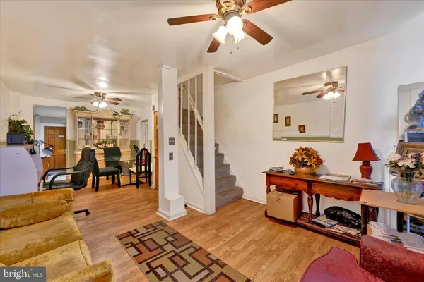 a living room with lots of furniture and a chandelier