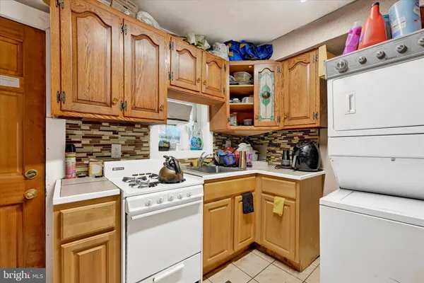 a kitchen with a cabinets and white appliances