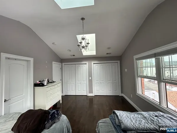 a bedroom with furniture and a window