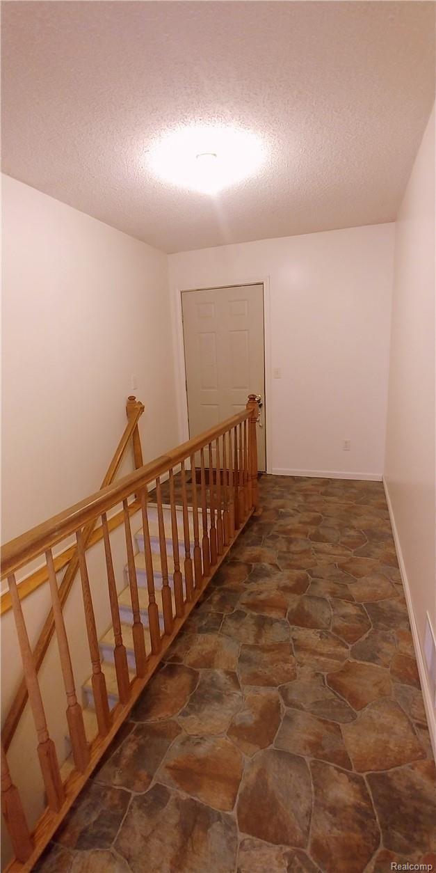 886 Chase Lake Road Howell, MI 48855 - Photo 26 of 52 10. Heading to Partially Finished Basement off Mudroom-garage entry