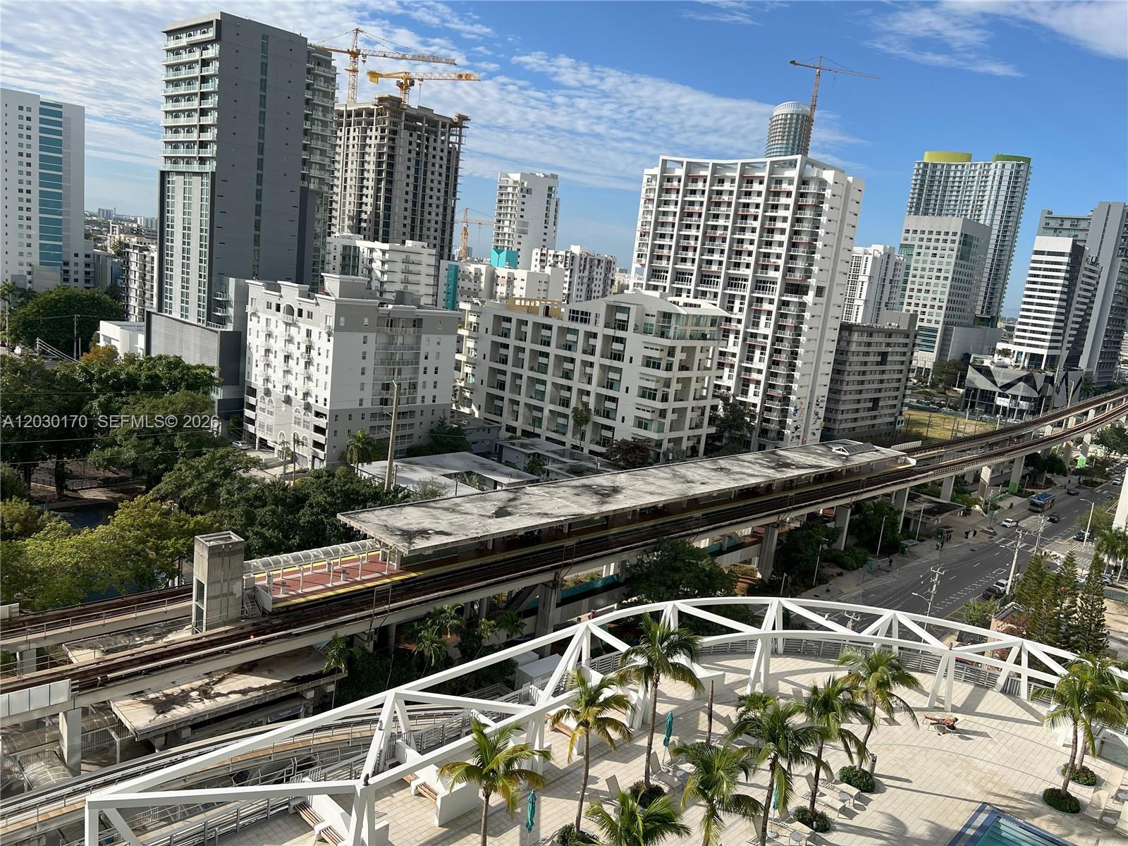 79 Southwest 12th Street, Unit 1710S Miami, FL 33130 - Photo 20 of 25 a view of a balcony with chairs