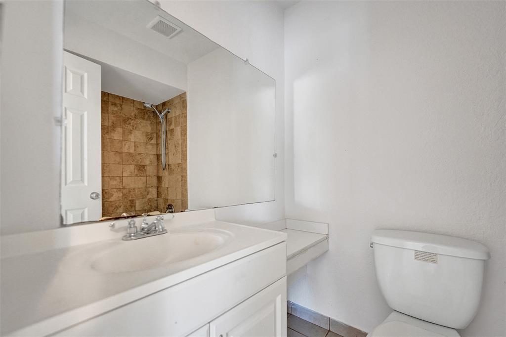 26 Wimbledon Lakes Drive, Unit 248 Plantation, FL 33324 - Photo 14 of 26 a bathroom with a sink a toilet and shower