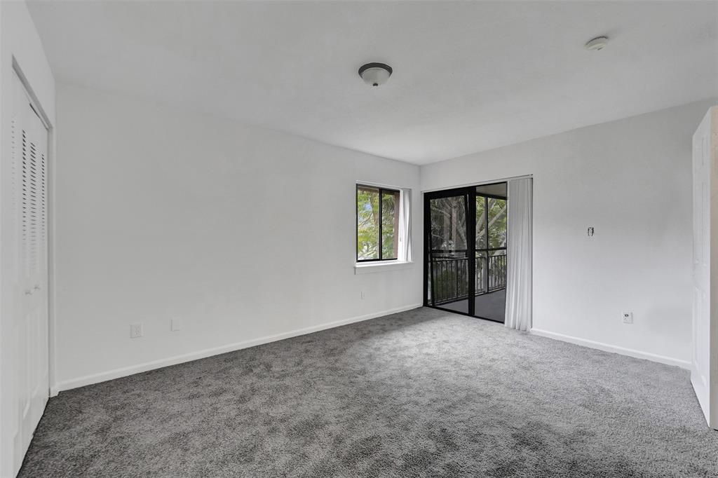 26 Wimbledon Lakes Drive, Unit 248 Plantation, FL 33324 - Photo 16 of 26 a view of an empty room with closet and windows