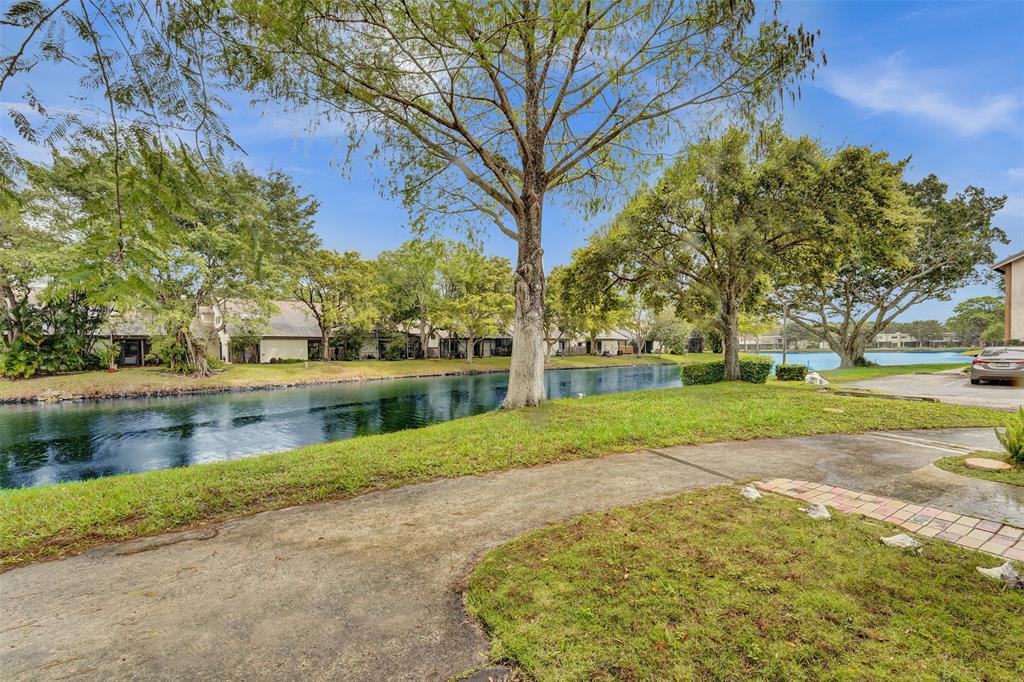 26 Wimbledon Lakes Drive, Unit 248 Plantation, FL 33324 - Photo 22 of 26 a view of backyard with green space