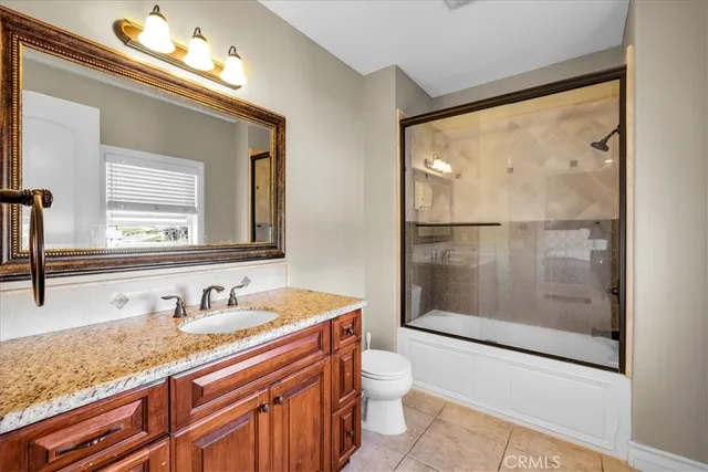 a spacious bathroom with a tub shower and mirror