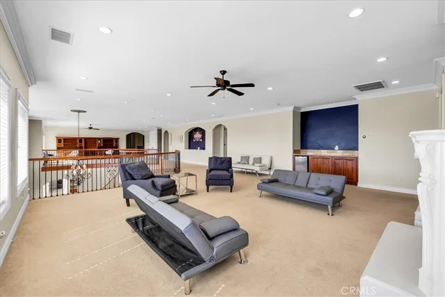 a view of an empty room with a cabinet and fire place