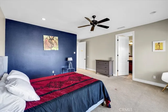 a balcony with furniture and a floor to ceiling window