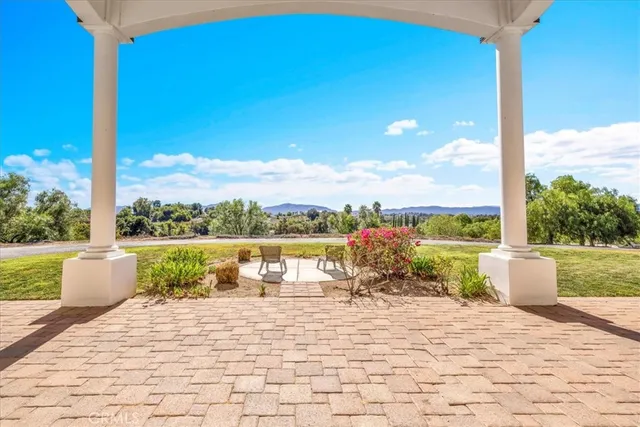 a view of entryway and hall with a front door