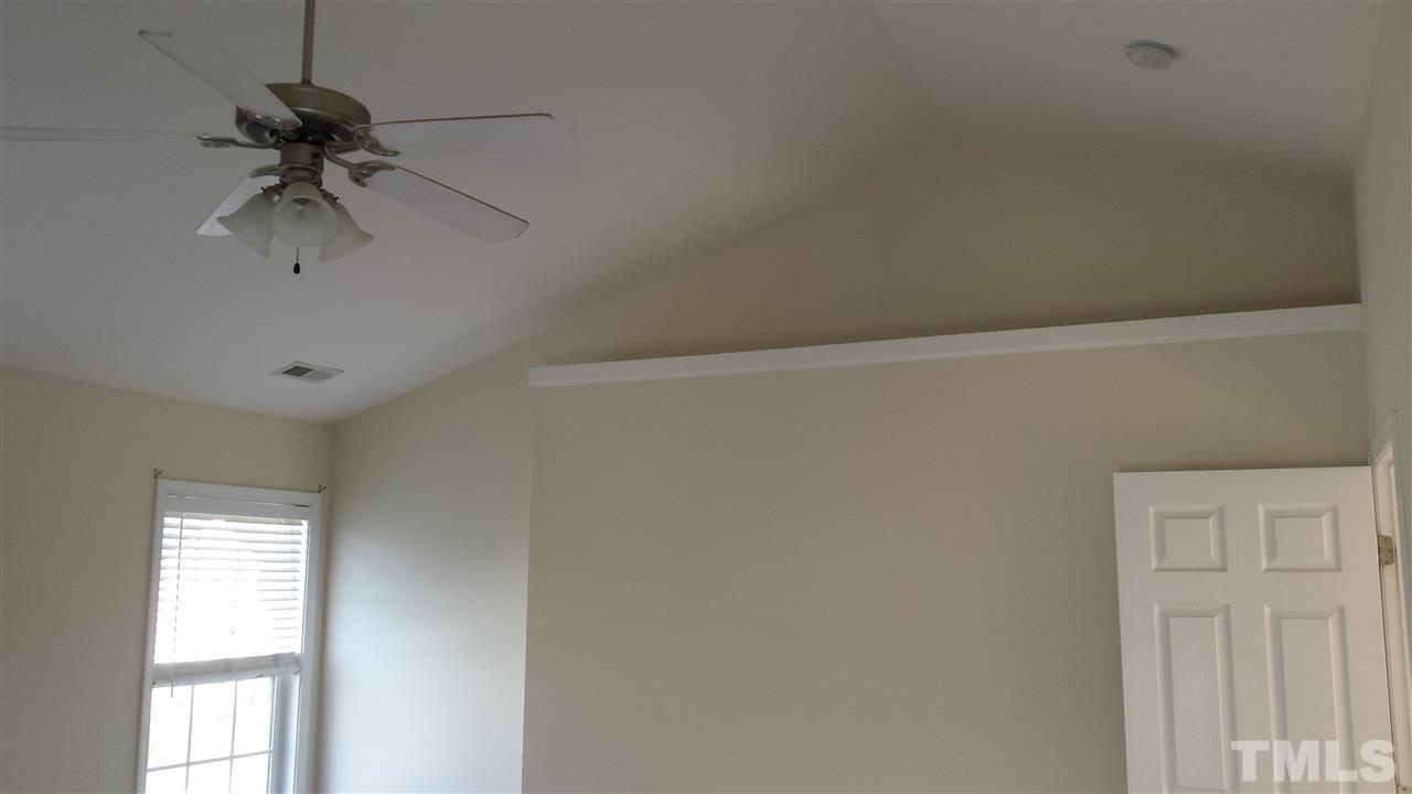 6912 Missionary Ridge Drive Raleigh, NC 27610 - Photo 14 of 16 a view of a chandelier fan in a room