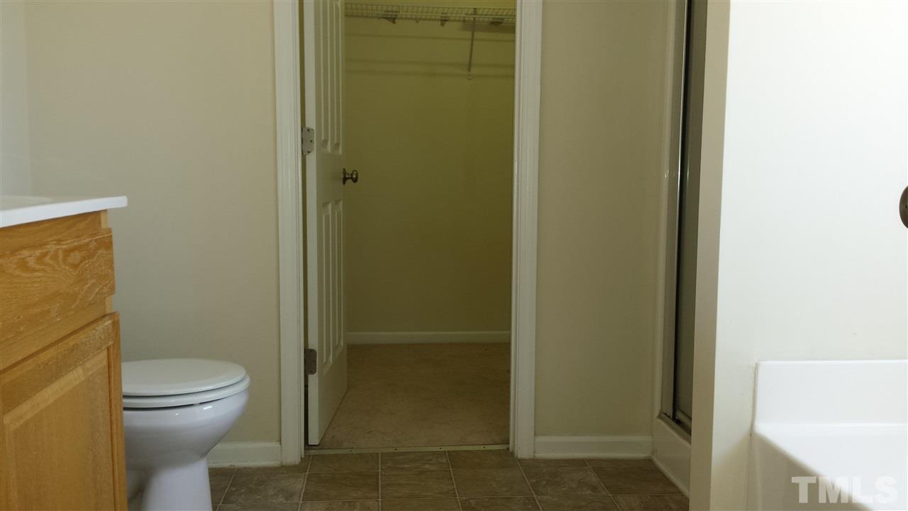 6912 Missionary Ridge Drive Raleigh, NC 27610 - Photo 15 of 16 a bathroom with a toilet and a shower