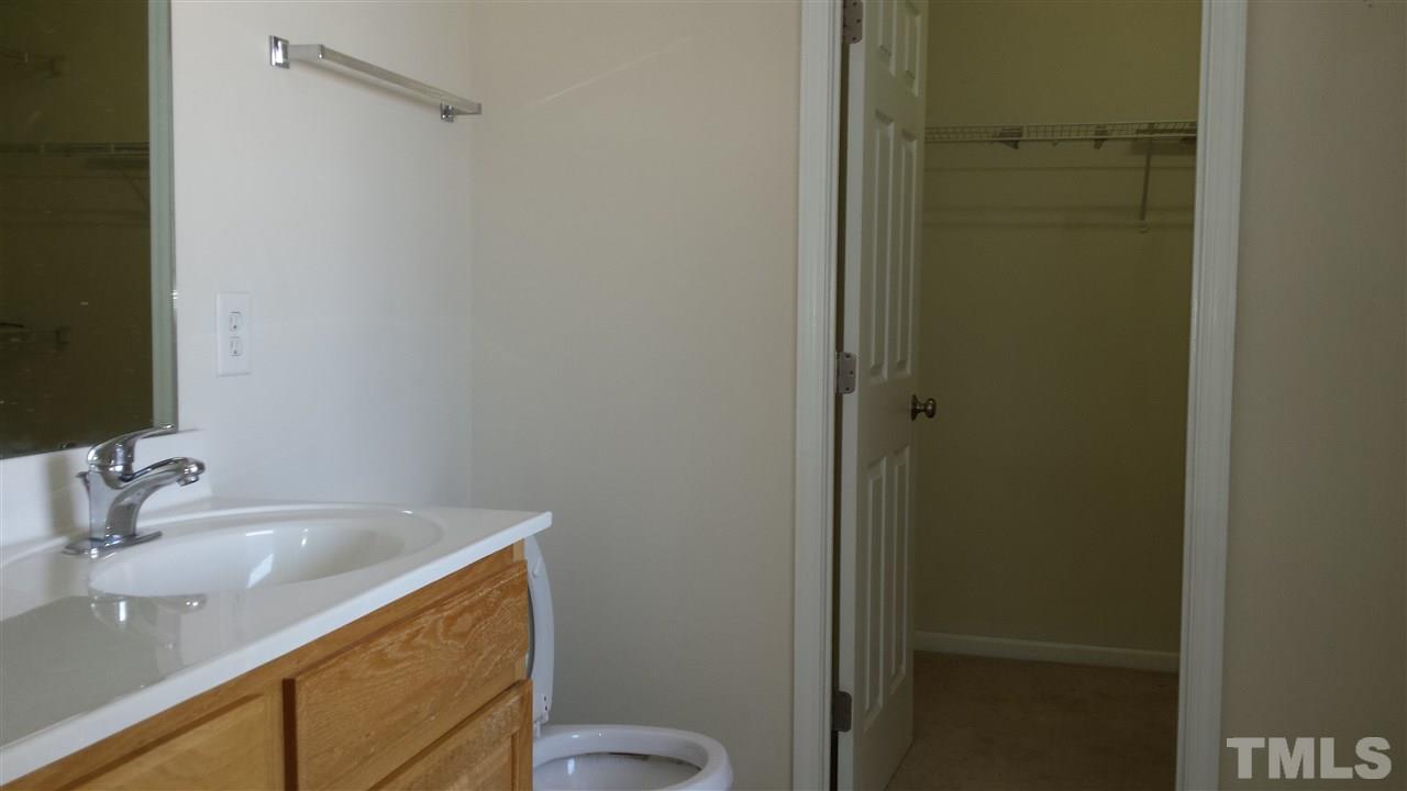 6912 Missionary Ridge Drive Raleigh, NC 27610 - Photo 16 of 16 a bathroom with a sink and a mirror