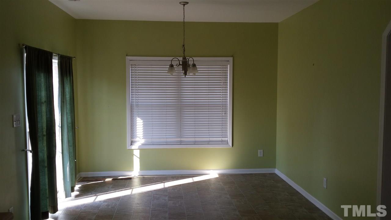 6912 Missionary Ridge Drive Raleigh, NC 27610 - Photo 9 of 16 a view of an empty room with a window
