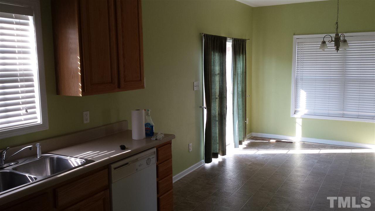 6912 Missionary Ridge Drive Raleigh, NC 27610 - Photo 10 of 16 a kitchen with a sink and a window