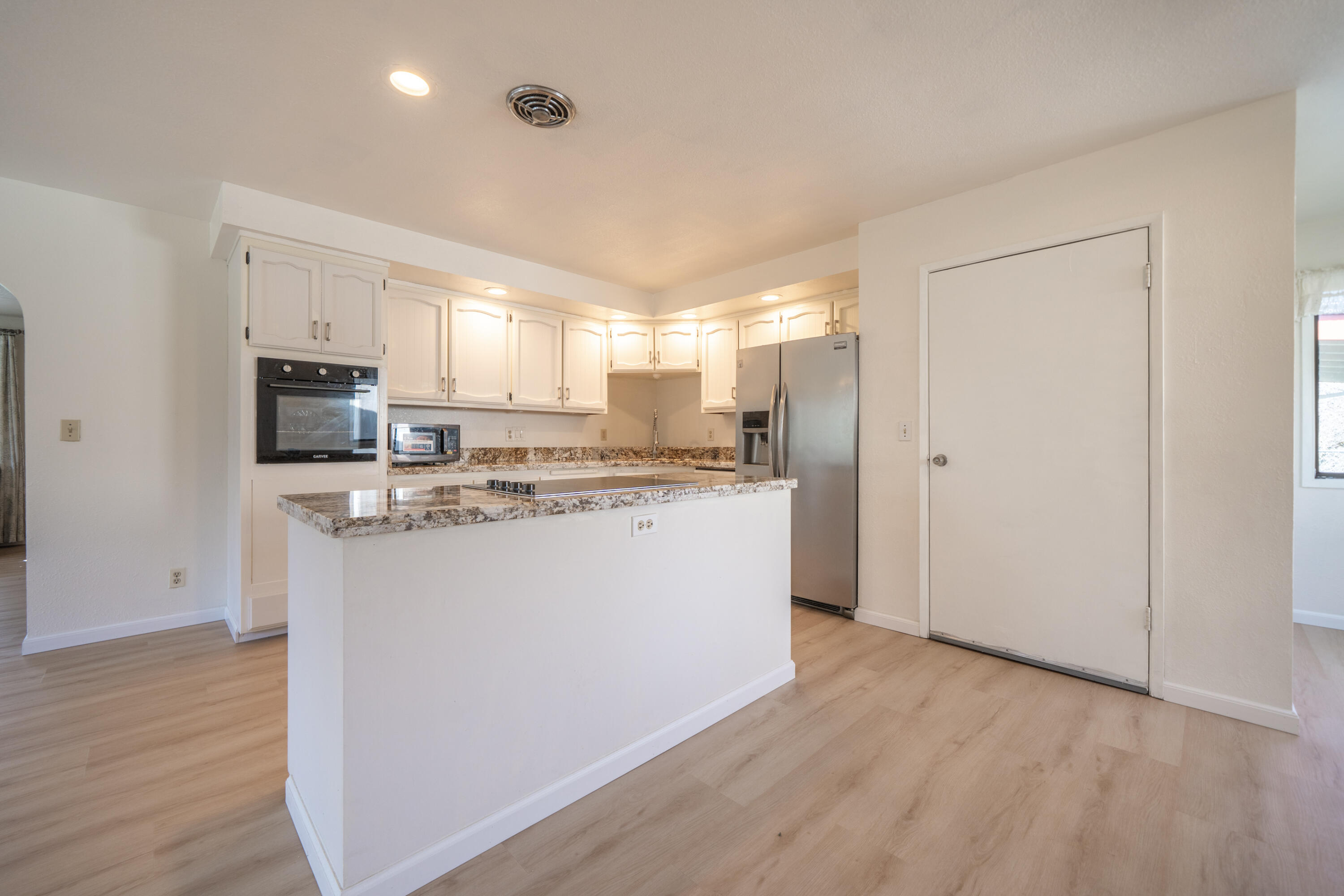 2580 Keswick Dam Road Redding, CA 96003 - Photo 12 of 60 a kitchen with stainless steel appliances granite countertop a refrigerator sink and microwave