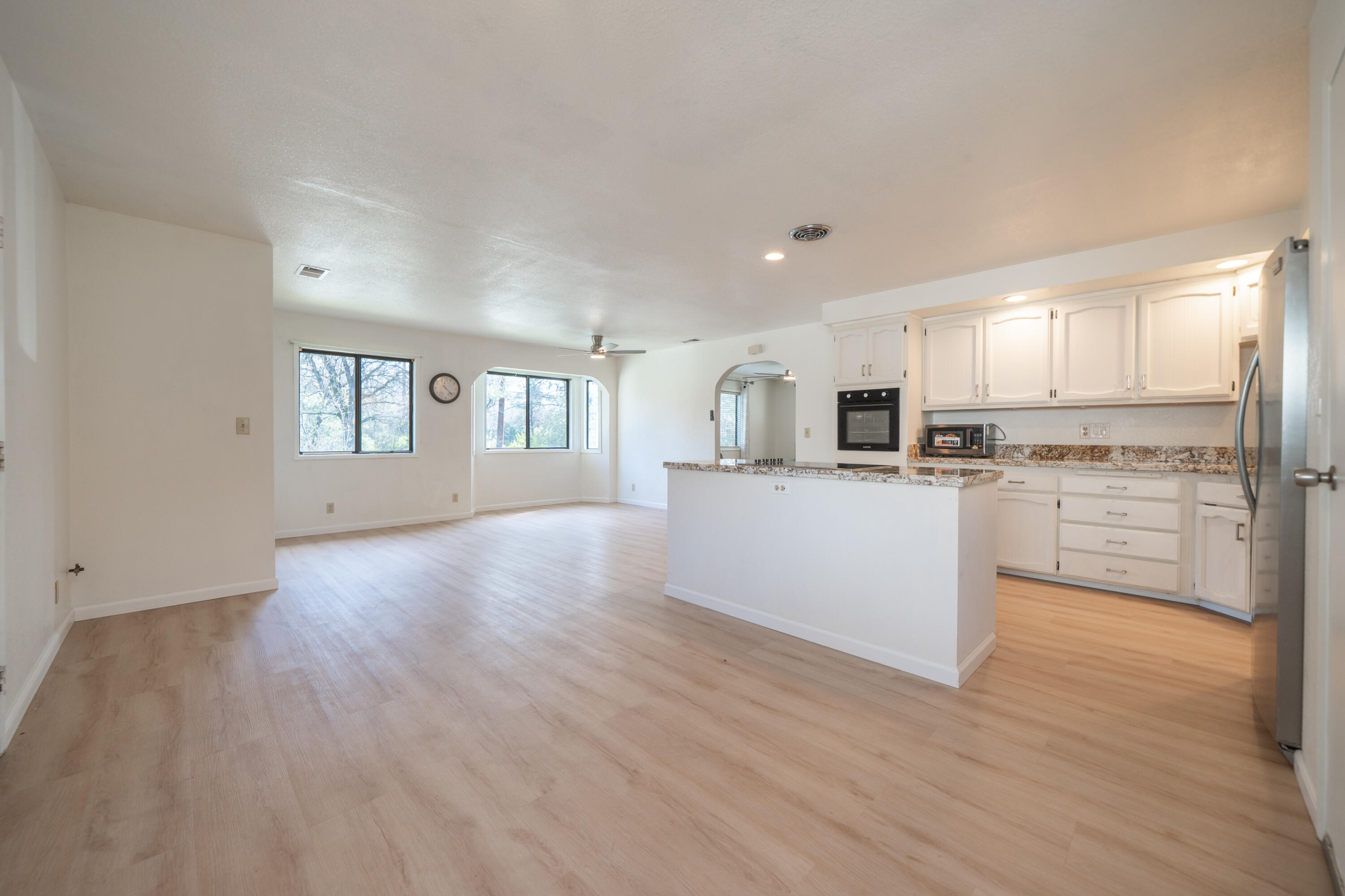 2580 Keswick Dam Road Redding, CA 96003 - Photo 13 of 60 a view of a kitchen with wooden floor and electronic appliances