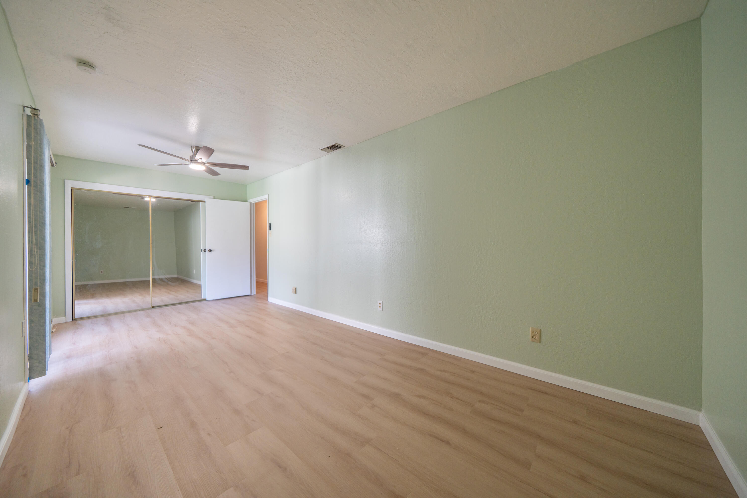 2580 Keswick Dam Road Redding, CA 96003 - Photo 24 of 60 a view of an empty room with wooden floor