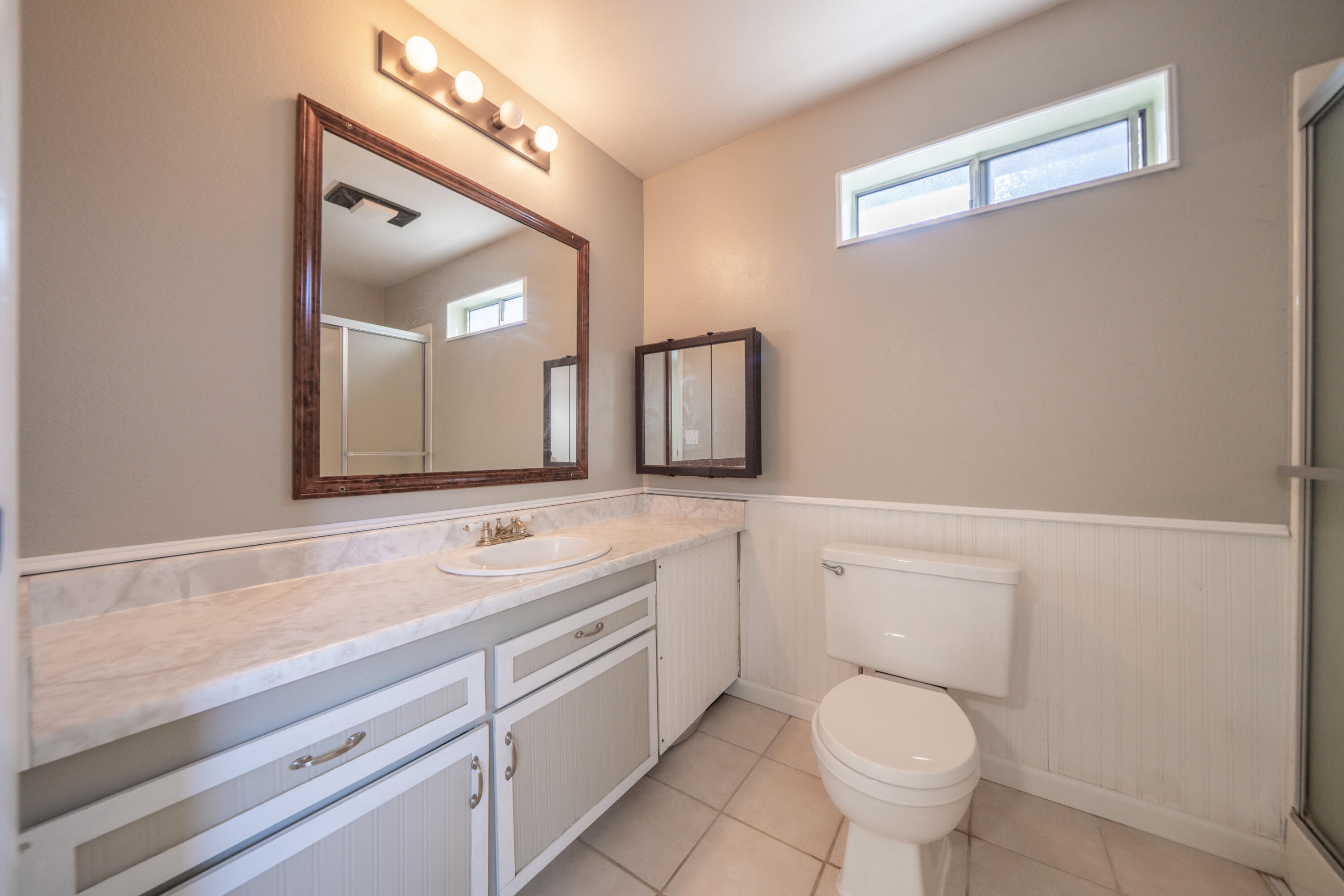 2580 Keswick Dam Road Redding, CA 96003 - Photo 28 of 60 a bathroom with a toilet sink and mirror