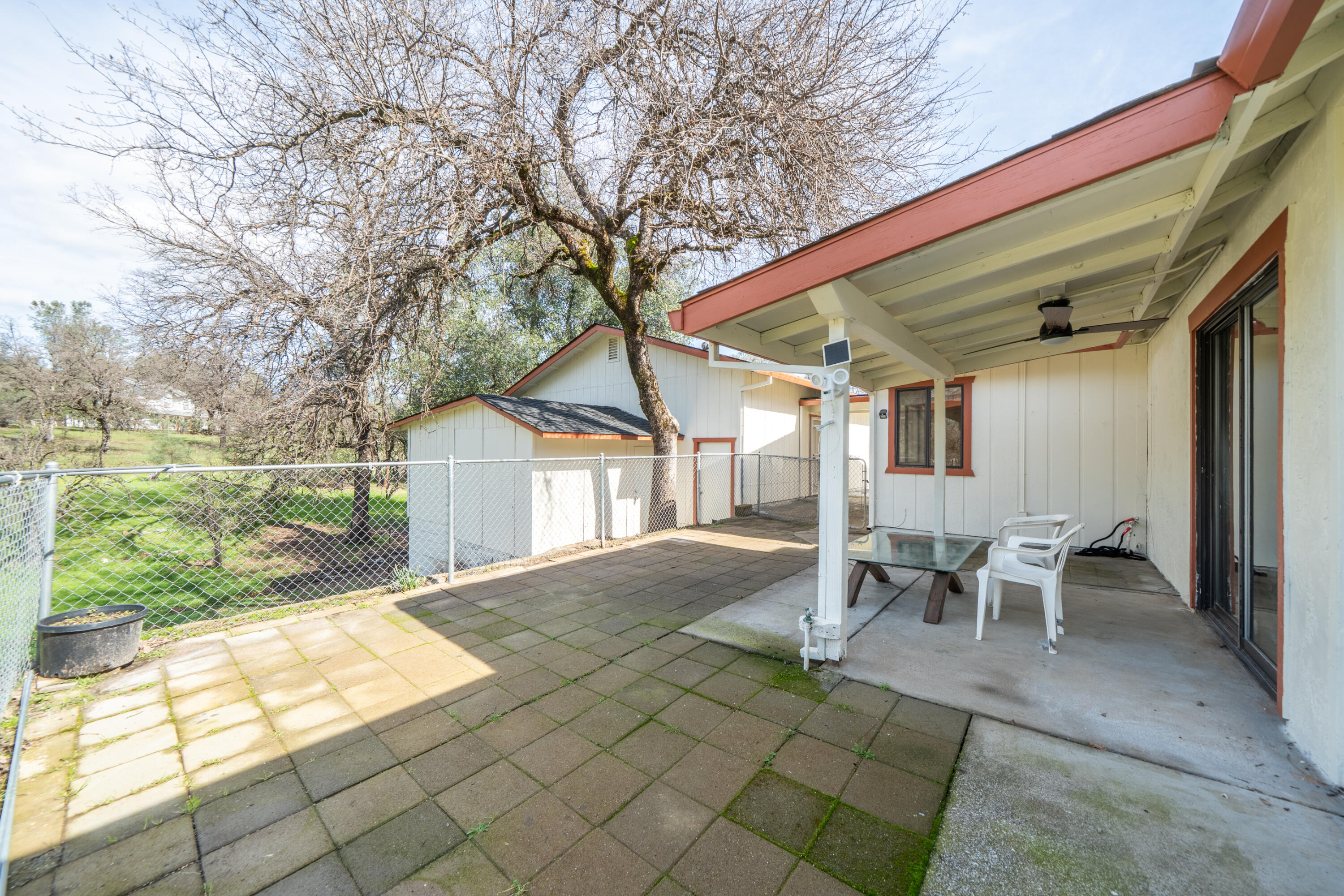 2580 Keswick Dam Road Redding, CA 96003 - Photo 41 of 60 a view of a patio with table and chairs near a yard