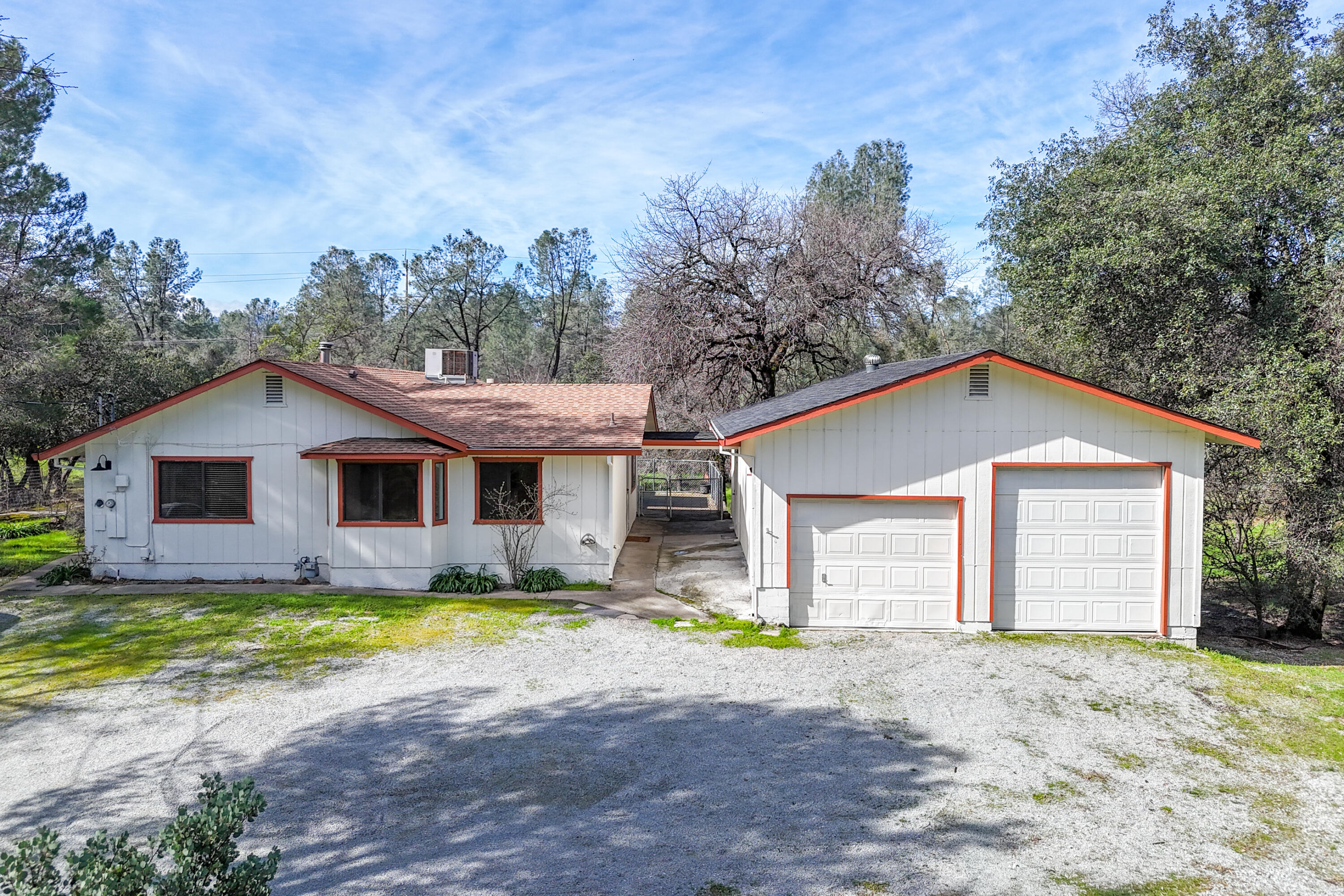 2580 Keswick Dam Road Redding, CA 96003 - Photo 57 of 60 a view of a yard in front of a house with large trees