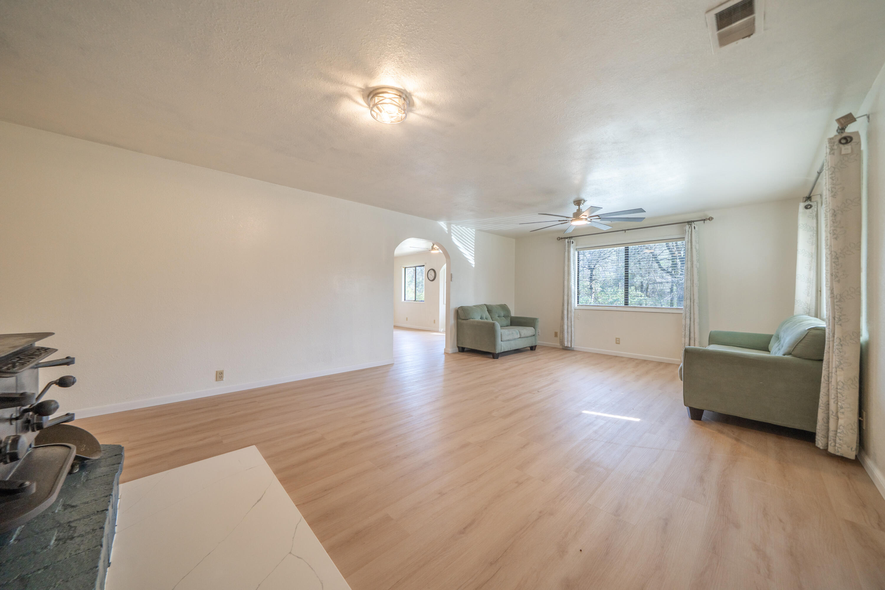 2580 Keswick Dam Road Redding, CA 96003 - Photo 6 of 60 wooden floor in an empty room with a window