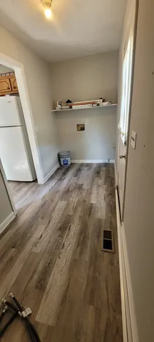 an empty room with wooden floor