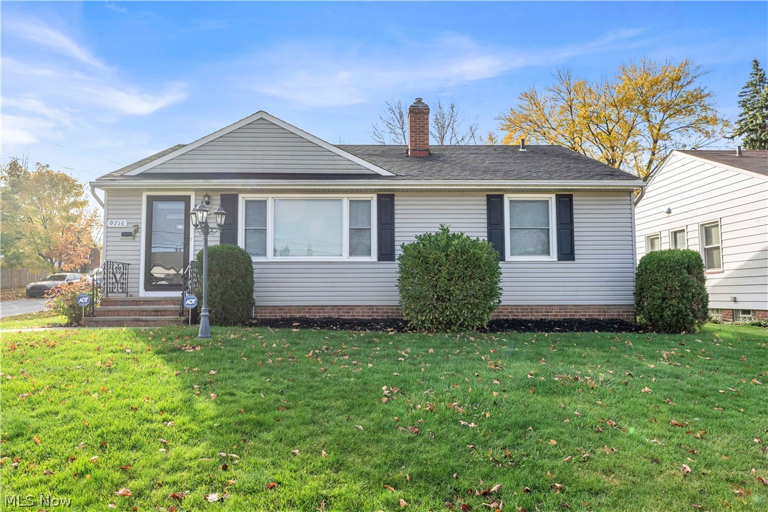 9716 Alexander Road Cleveland, OH 44125 - Photo 1 of 30 View of front of home featuring a chimney and a front lawn