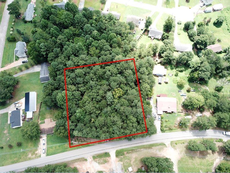 643 Wesley Chapel Road Villa Rica, GA 30180 - Photo 1 of 1 an aerial view of a house with a yard and garden view