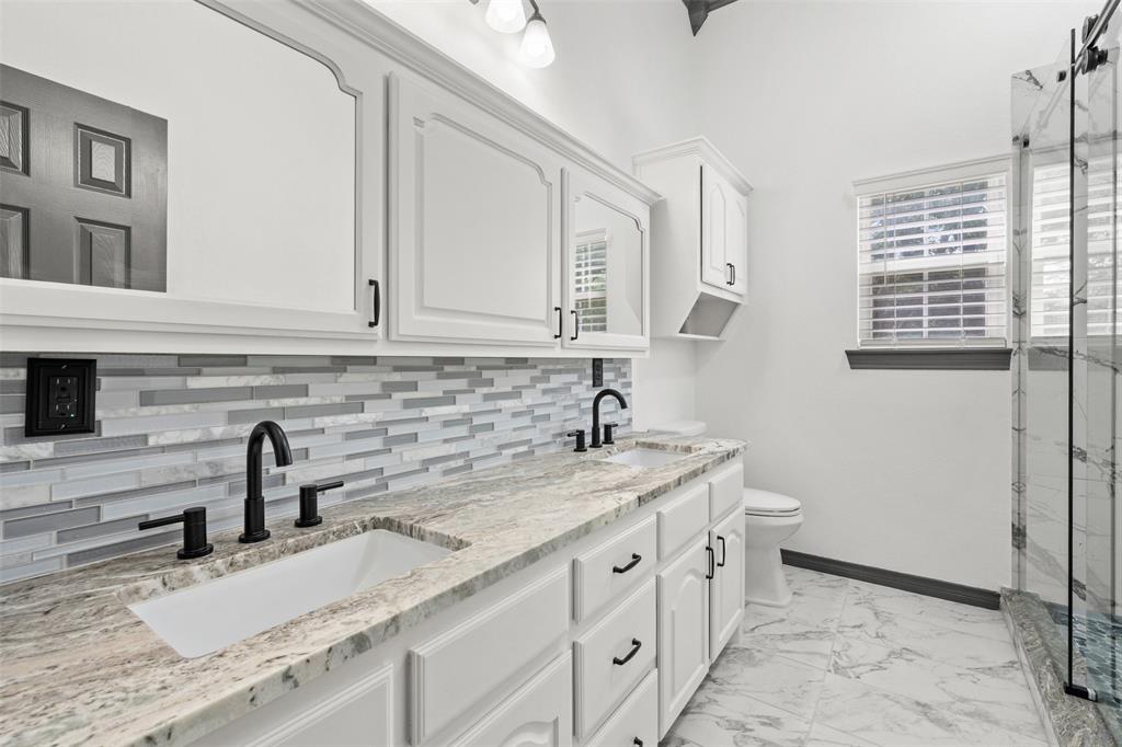 3091 Rockbridge Road McGregor, TX 76657 - Photo 19 of 40 a kitchen with a sink and cabinets