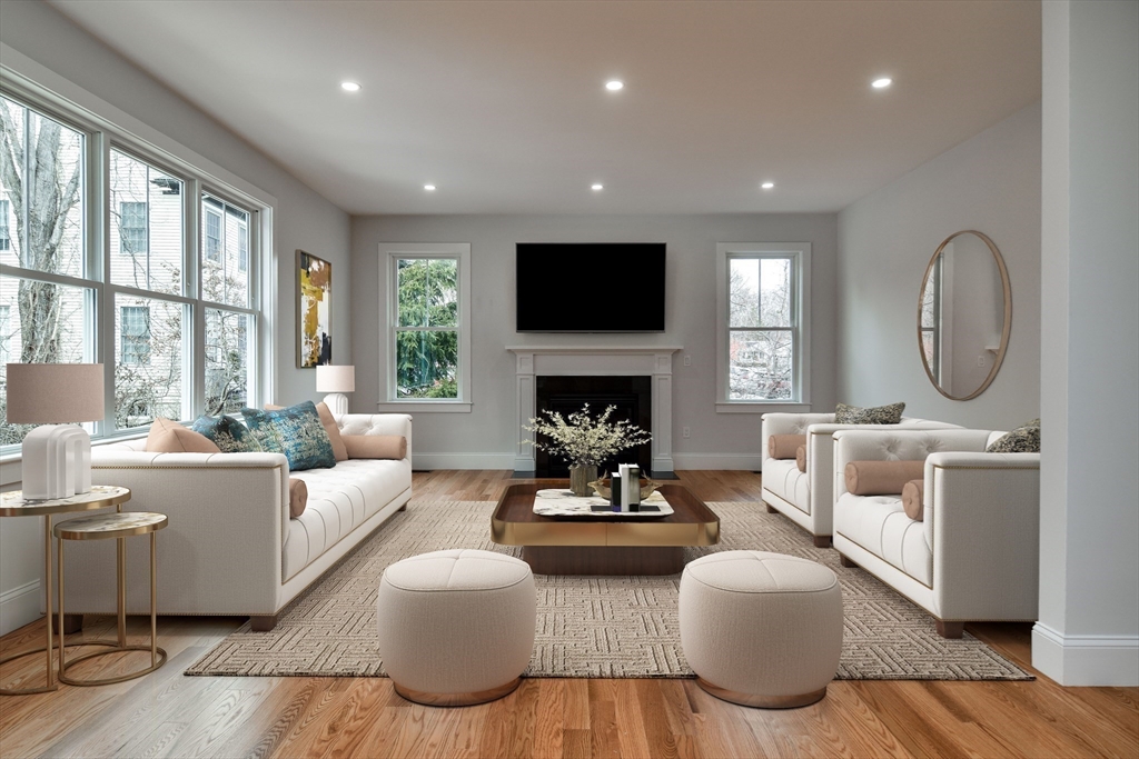75 Cottage Street Natick, MA 01760 - Photo 11 of 37 a living room with fireplace furniture and a flat screen tv