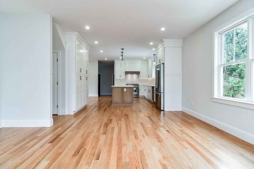 75 Cottage Street Natick, MA 01760 - Photo 13 of 37 a view of empty room with wooden floor and window