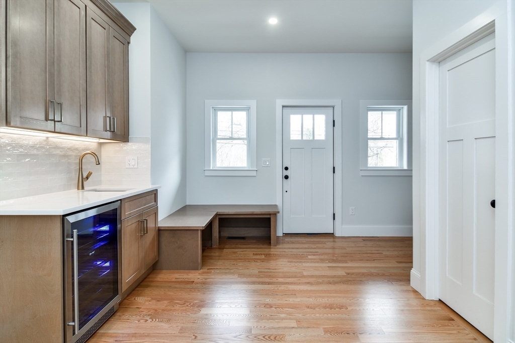 75 Cottage Street Natick, MA 01760 - Photo 14 of 37 a view of kitchen with kitchen island wooden floors and wooden cabinets