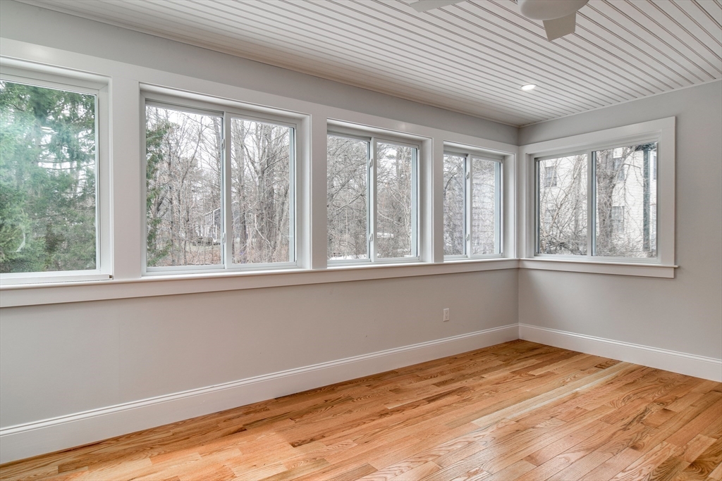 75 Cottage Street Natick, MA 01760 - Photo 18 of 37 a view of empty room with wooden floor and fan