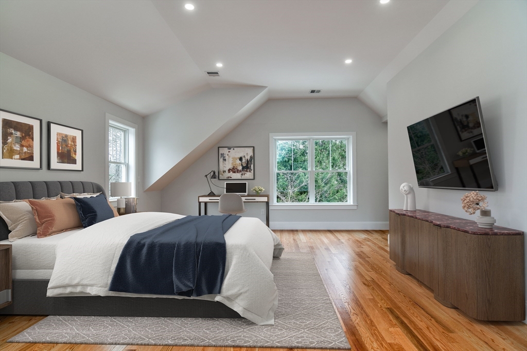 75 Cottage Street Natick, MA 01760 - Photo 20 of 37 a spacious bedroom with a large bed and a flat screen tv