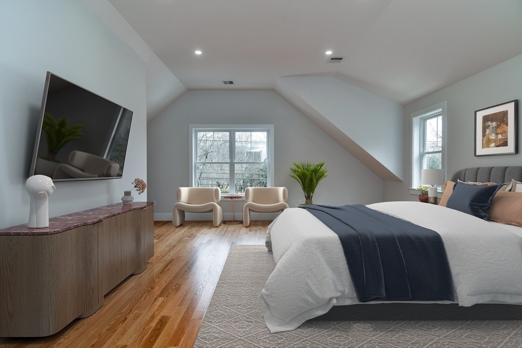 75 Cottage Street Natick, MA 01760 - Photo 21 of 37 a spacious bedroom with a bed and a flat screen television